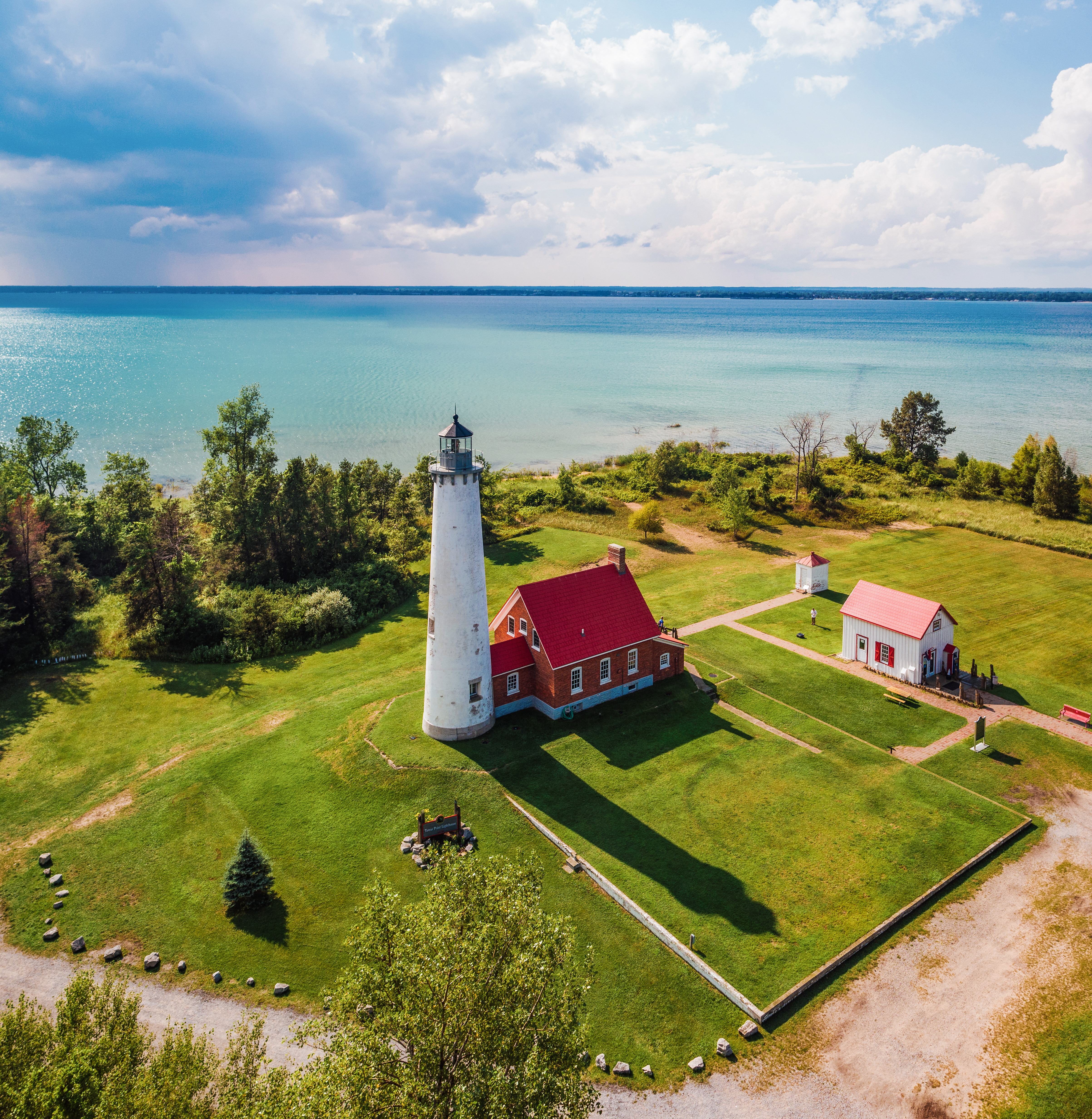 Tawas Point Lighthouse Lighthouse near the shore of Lake Huron during summer